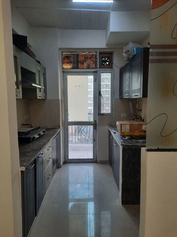 Kitchen in 2 BHK Apartment at Prateek Wisteria, Sector 77 – for Rent