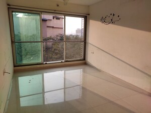 Room in 2 BHK Apartment at Paradigm Ananda Residency, Borivali West – for Sale