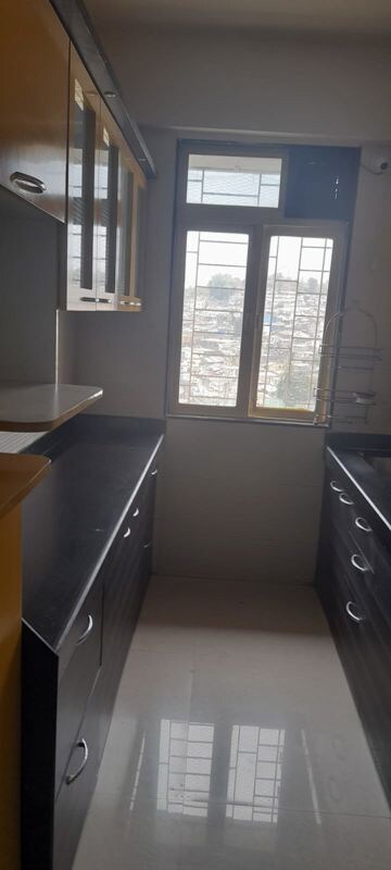 Kitchen in 1 BHK Apartment at Cosmos Residancy, Kavesar – for Sale