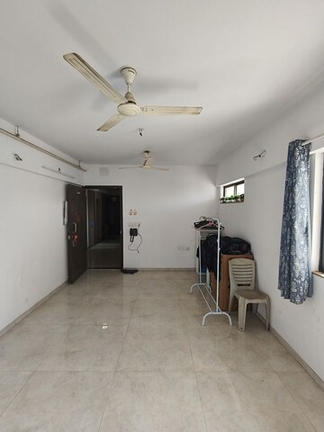 Living Room in 1 BHK Apartment at Lodha Downtown, Dombivli East – for Rent