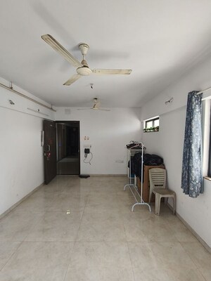 Living Room in 1 BHK Apartment at Lodha Palava Downtown, Dombivli East – for Sale