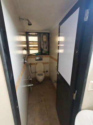 Bathroom in 2 BHK Apartment at Patel CHS Giragaon, Girgaon – for Rent
