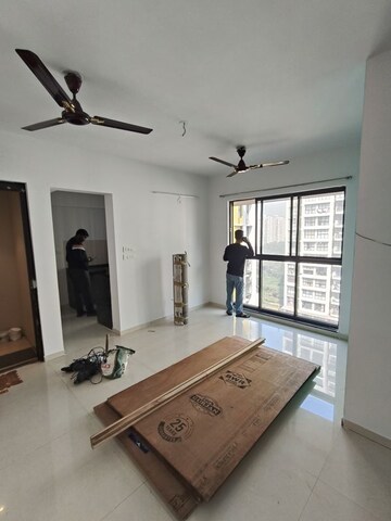 Living Room in 1.5 BHK Apartment at Lodha Lakeshore Greens, Dombivli East – for Rent