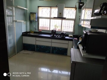 Kitchen in 3 BHK Apartment at Cosmos Park, Ghodbunder Road – for Rent