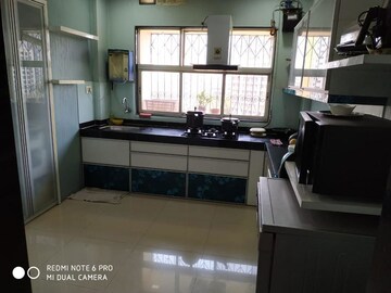 Kitchen in 3 BHK Apartment at Cosmos Park, Ghodbunder Road – for Rent
