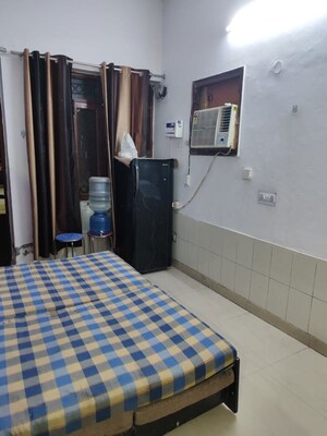 Bedroom in 1 BHK Builder Floor at Dhavalgiri Apartment Sector 11, Sector 11 – for Rent