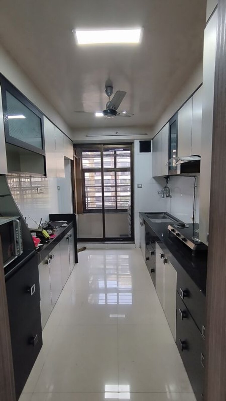 Kitchen, kalpataru-srishti-344-chs-ltd 2.5 Bedroom 1235 Sq.Ft. Apartment In Mira Road Thane 9807444