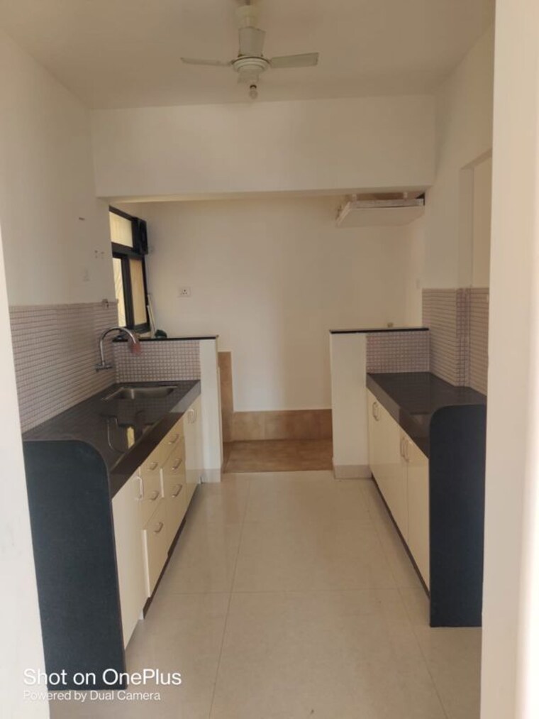 Kitchen, atul-western-hills-phase-2 2.5 Bedroom 11000 Sq.Ft. Apartment In Baner Pune 9807460