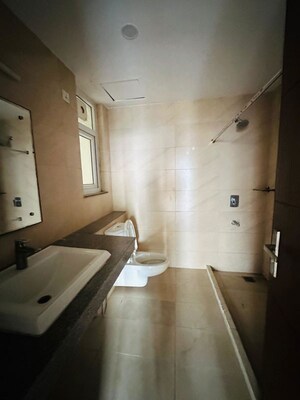 Bathroom in 4 BHK Apartment at Puri Anand Villas Phase II, Sector 81 – for Rent