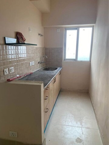 Kitchen in 1 BHK Apartment at Amrapali Dream Valley – for Rent