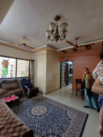 Living Room in 2 BHK Apartment at Golden Park CHS, Kulgaon – for Rent