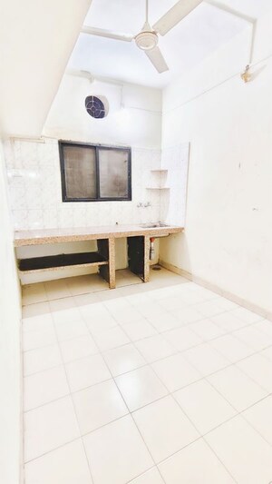 Kitchen in 1 BHK Apartment at Wadgaon Sheri – for Rent