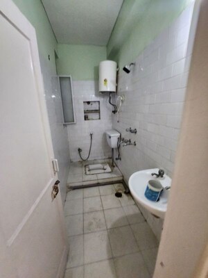 Bathroom in 2 BHK Apartment at Karthik Apartment, Sector 21c – for Rent