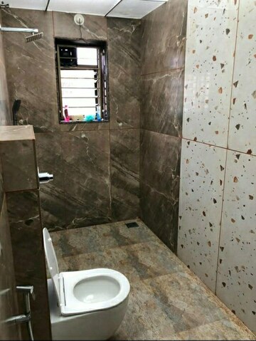 Bathroom in 1 BHK Apartment at Riddhi Enclave Co-op Housing Society Ltd, Viman Nagar – for Rent