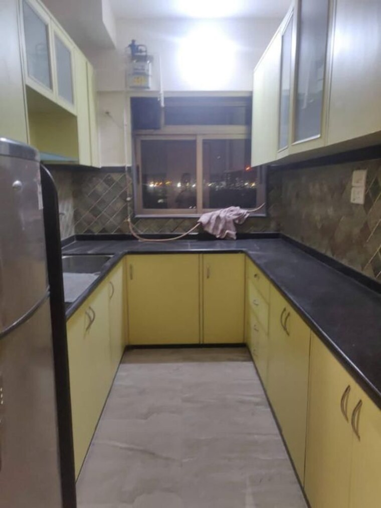 Kitchen, ajmera-cosmic-heights 3 Bedroom 1000 Sq.Ft. Apartment In Bhakti Park Mumbai 9808978