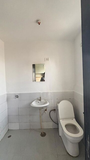 Bathroom in 1 RK Apartment at Microtek Greenburg, Sector 86 – for Sale