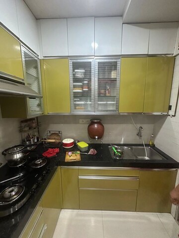 Kitchen in 2 BHK Apartment at MICL Aaradhya Highpark, Mira Road – for Rent