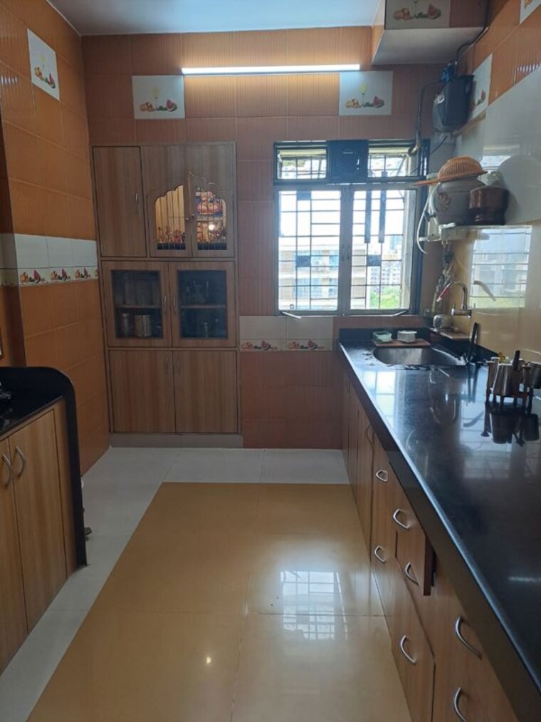 Kitchen, unique-poonam-estate-cluster-2 2 Bedroom 675 Sq.Ft. Apartment In Mira Road Thane 9809990