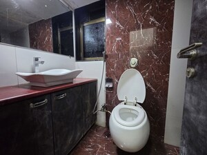 Bathroom in 3 BHK Apartment at Unnat Nagar CHS, Goregaon West – for Rent