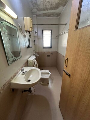 Bathroom in 2 BHK Apartment at Heimat Apartment, Santacruz West – for Rent