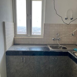 Kitchen in 3 BHK Apartment at Conscient Habitat 78, Faridpur – for Sale