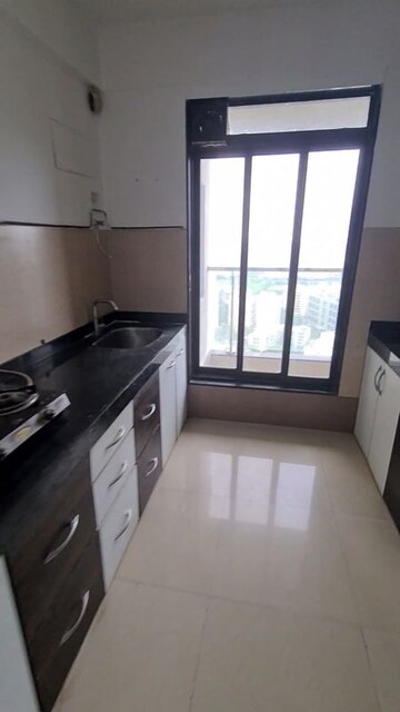 Kitchen in 2.5 BHK Apartment at Rustomjee Elanza, Malad West – for Sale