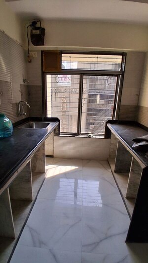Kitchen in 2 BHK Apartment at DGS Sheetal Bhavan, Malad East – for Rent