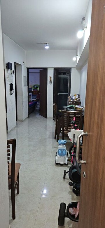 Living Room in 1 BHK Apartment at Lodha Amara, Kolshet Road – for Sale