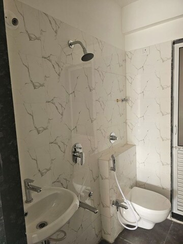 Bathroom in 2 BHK Apartment at Yash Anand CHS Charai, Charai – for Sale