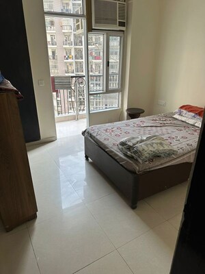 Bedroom in 3 BHK Apartment at Prateek Wisteria, Sector 77 – for Rent