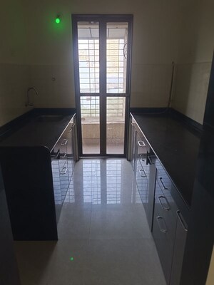 Kitchen in 2 BHK Apartment at Hubtown Greenwoods, Vartak Nagar – for Sale