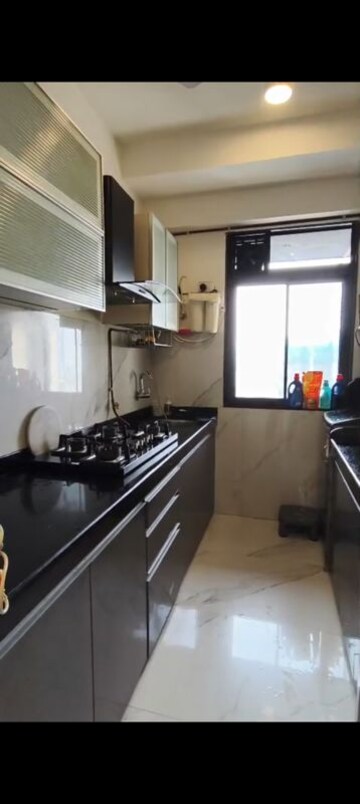Kitchen in 2 BHK Apartment at Dev Leo Tower, Oshiwara – for Rent