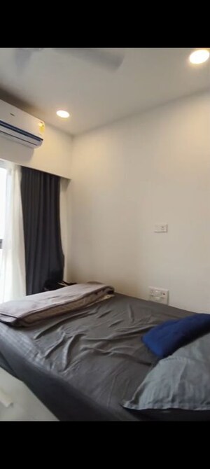 Bedroom in 2 BHK Apartment at Dev Leo Tower, Oshiwara – for Rent