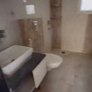 Bathroom in 3 BHK Apartment at Oxirich Avenue, Ahinsa Khand 2 – for Rent