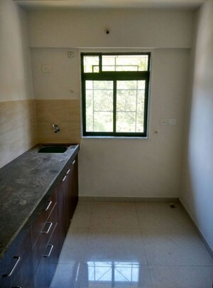 Kitchen in 1 BHK Apartment at Om New Aashirwad CHS, Malad West – for Sale