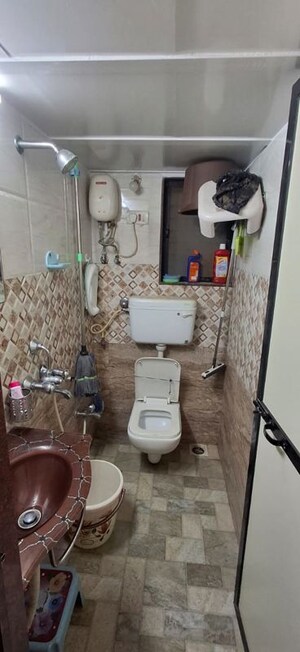Bathroom in 1 BHK Apartment at Takshila CHS, Andheri East – for Rent