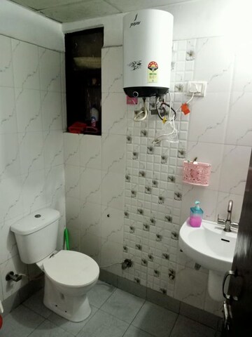 Bathroom in 3 BHK Apartment at Raj Nagar Extension – for Rent