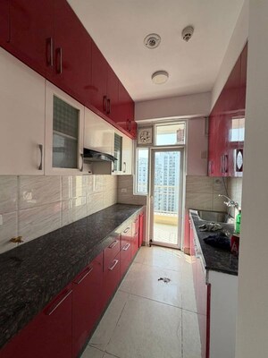 Kitchen in 2 BHK Apartment at Ajnara Homes, Sector 16b Greater Noida – for Rent