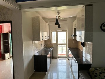 Kitchen in 2.5 BHK Apartment at Aims Golf City, Sector 75 – for Rent