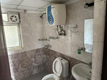 Bathroom in 2.5 BHK Apartment at Aims Golf City, Sector 75 – for Rent