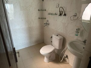 Bathroom in 2.5 BHK Apartment at Aims Golf City, Sector 75 – for Rent