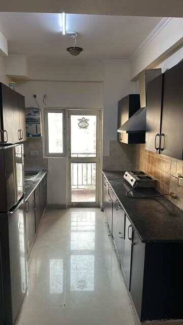 Kitchen in 2 BHK Apartment at Aims Golf City, Sector 75 – for Rent