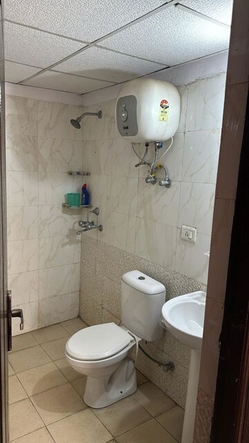 Bathroom in 2 BHK Apartment at Aims Golf City, Sector 75 – for Rent
