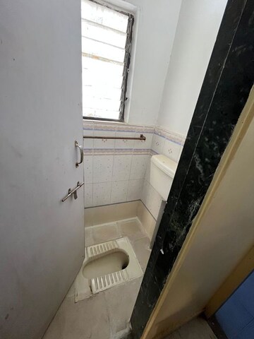 Bathroom in 1 BHK Apartment at Varanasi Society, Warje – for Sale