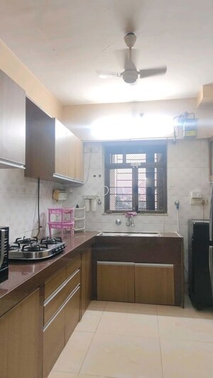 Kitchen in 2 BHK Apartment at Jasmine Tower, Vasant Vihar – for Sale