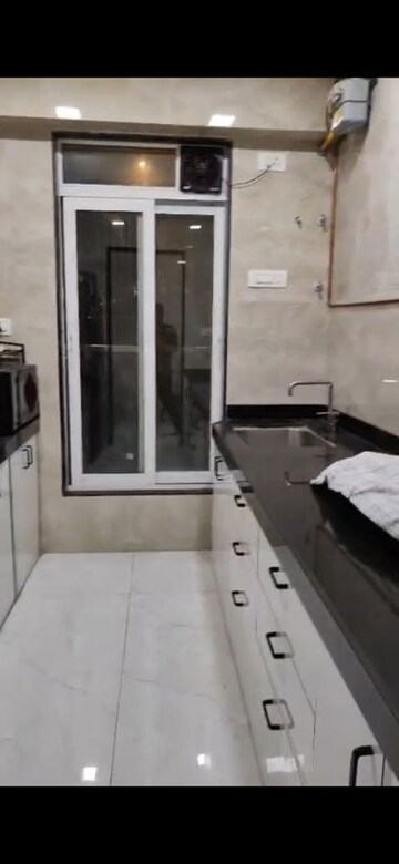 Kitchen in 2 BHK Apartment at Triumph Swastik, Malad West – for Rent