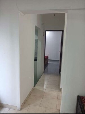 Building Lobby in 2 BHK Apartment at Sheth Vasant Lawns, Laxmi Nagar – for Rent