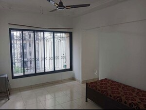 Bedroom in 2 BHK Apartment at Sheth Vasant Lawns, Laxmi Nagar – for Rent