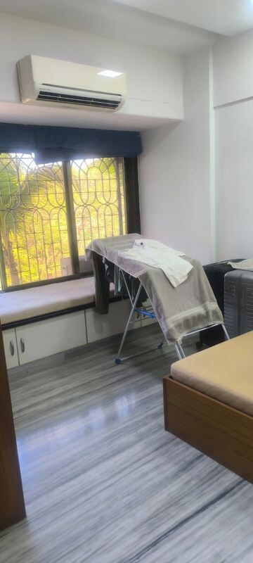 Bedroom in 2 BHK Apartment at Kumar Harshvardhan CHS, Andheri West – for Rent