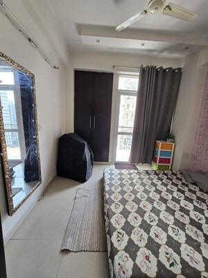 Bedroom in 2.5 BHK Apartment at Amrapali Silicon City, Sector 76 – for Sale